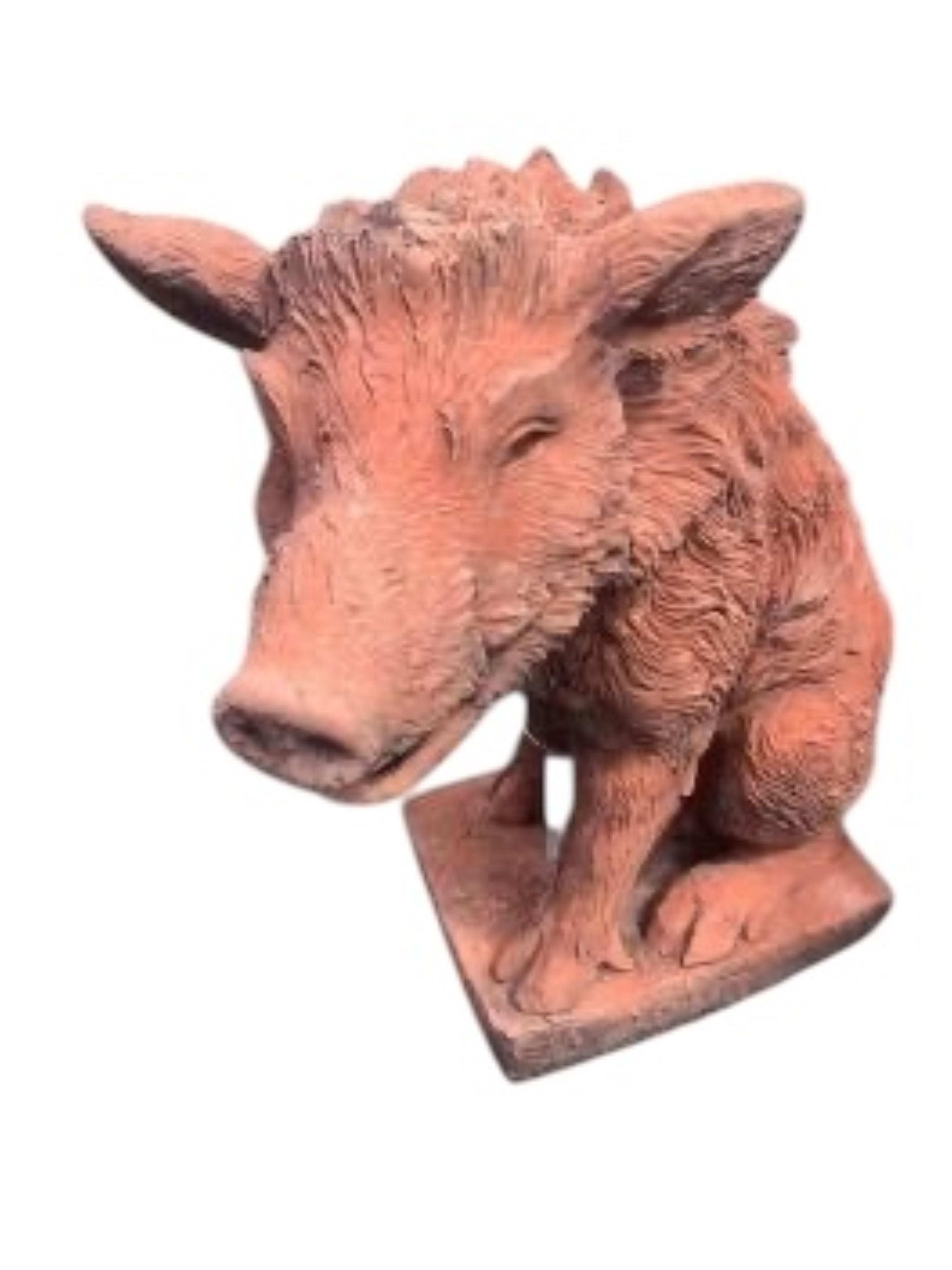 A pair of terracotta seated wild boar garden ornaments, height 55cm